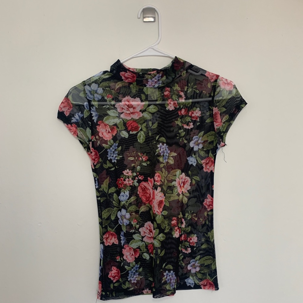 sheer black top with colorful flowers